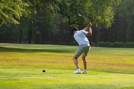 Golfer driving from the tee at Soldier Hill Golf Course.