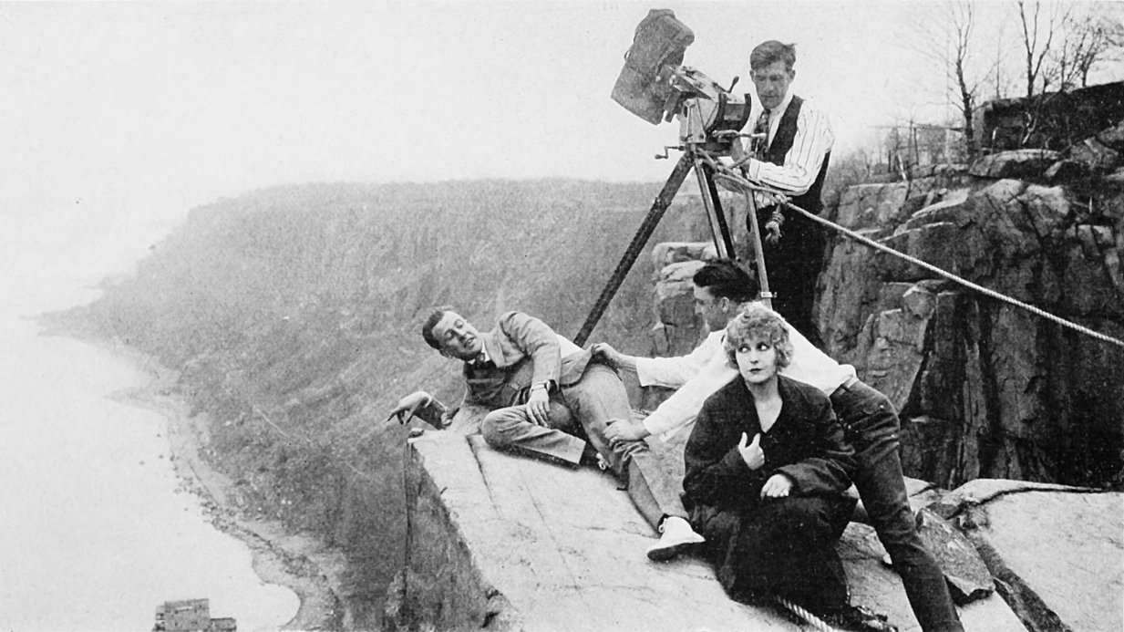 Pearl White and Antonio Moreno on a Palisades ledge with a camera crew filming The House of Hate.