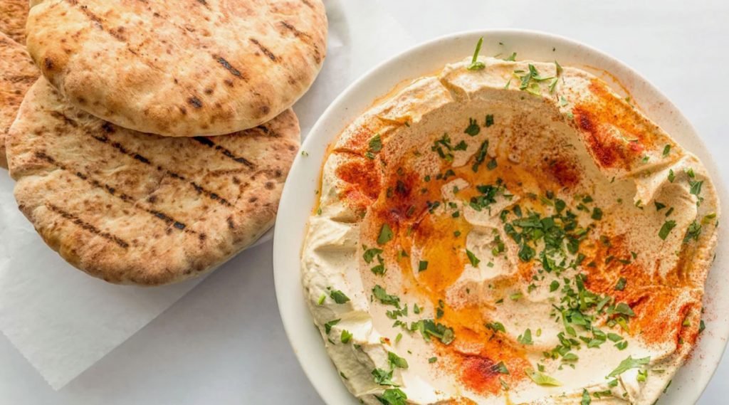 Sababa Grill’s photograph of a hummus plate and fresh pita.